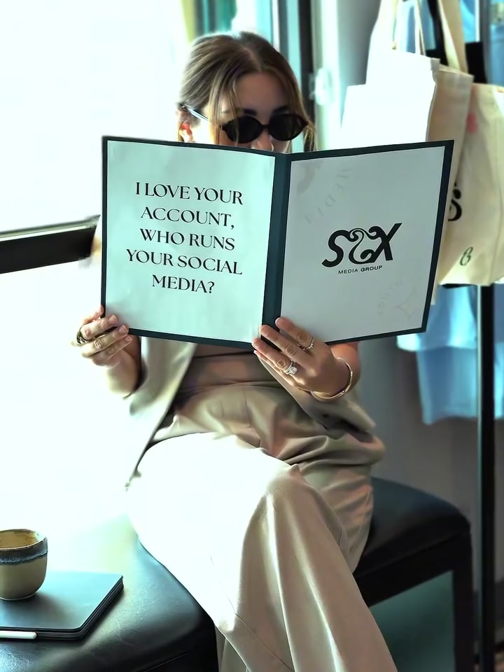 STX Media Group founder Yesenia holding an open brand menu — “I love your account, who runs your social media?”